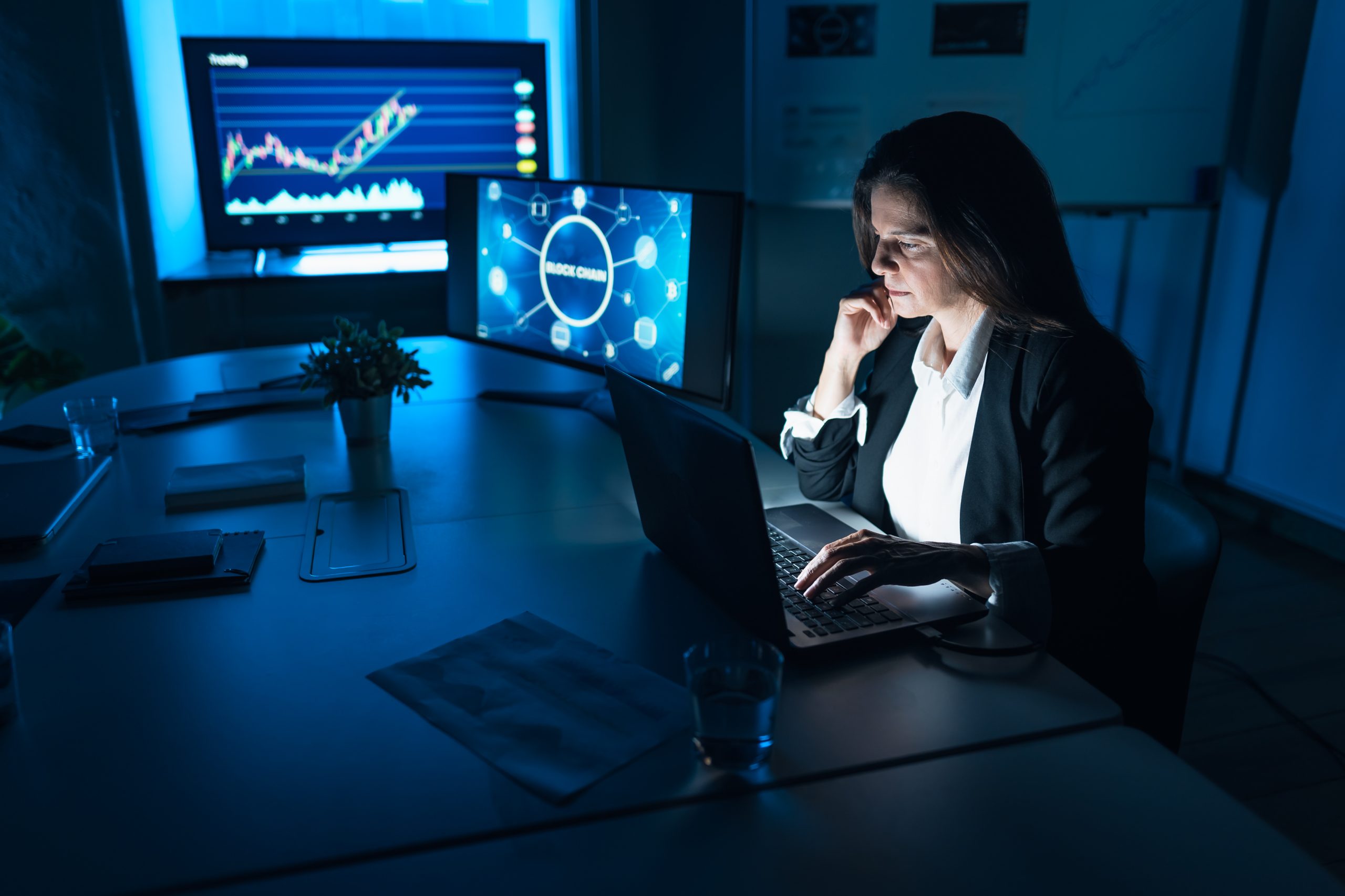 Business stock trader woman working on crypto currency markets w
